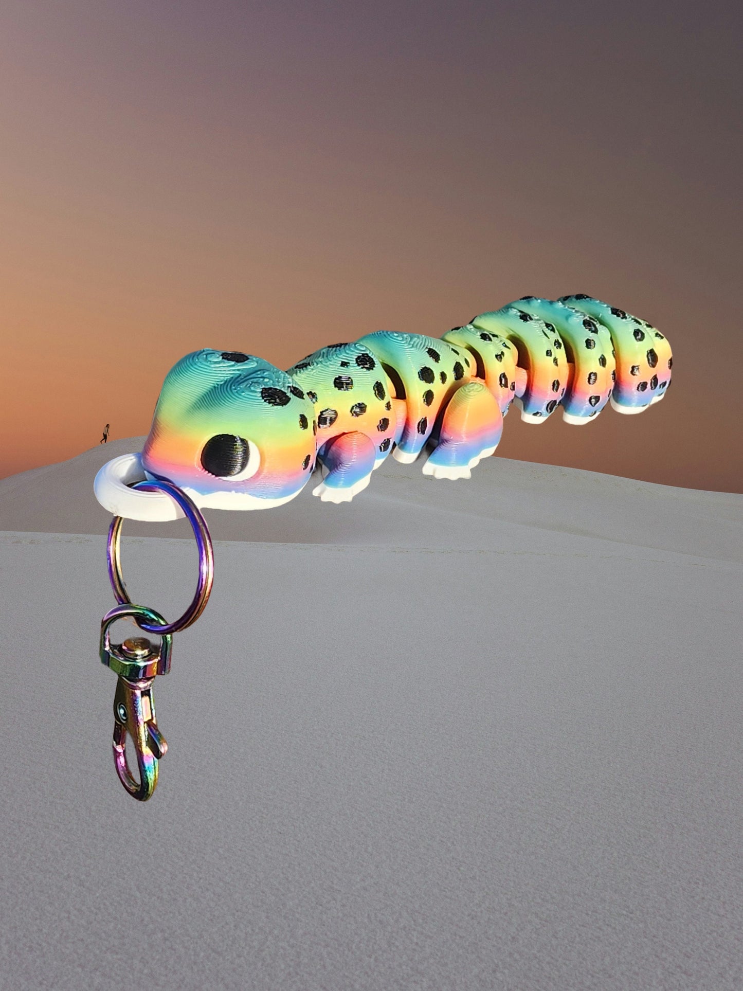 a multicolored fish keychain hanging from a hook