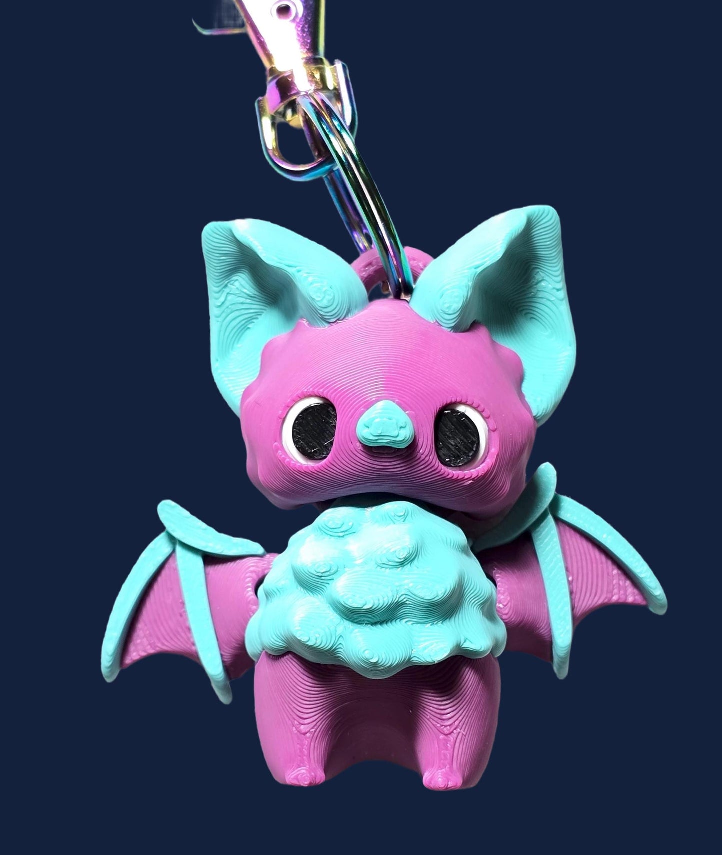 a pink and blue toy with a toothbrush in it&#39;s mouth